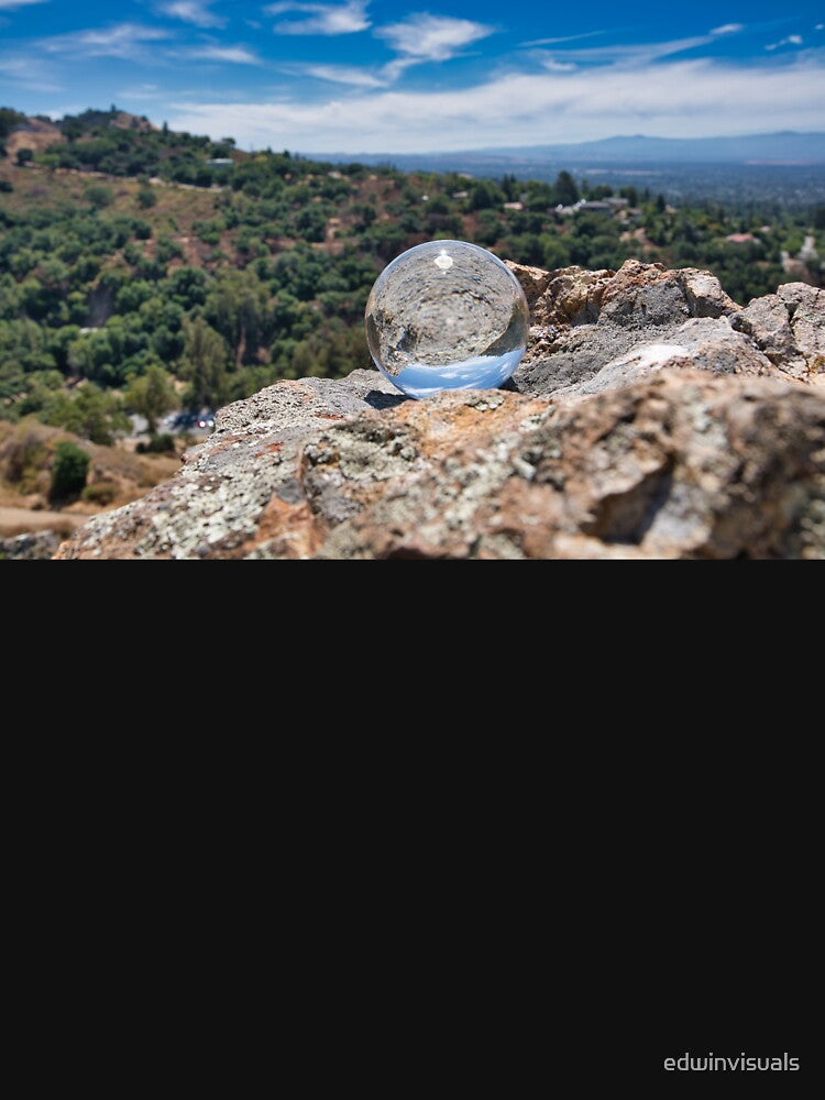 Reflection Of A Rock Forest And A Sky Landscape Through A Crystal Ball by edwinvisuals
