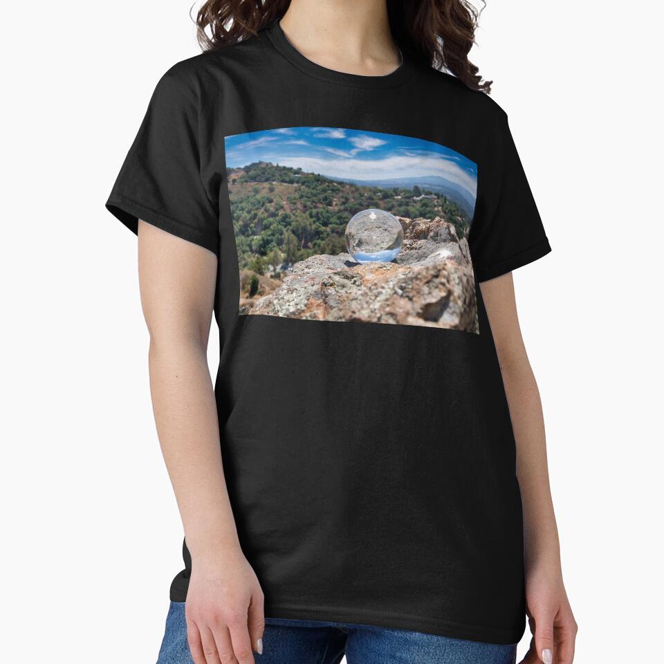 Reflection Of A Rock Forest And A Sky Landscape Through A Crystal Ball by edwinvisuals