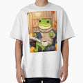Wholesome Frog Reading T-Shirt | Cozy Autumn Animal Art | Cute Fall Tee by ArmaanArts
